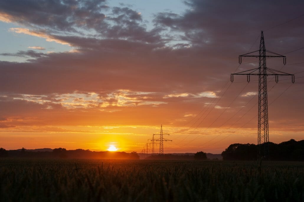 Sunset and electricity pylons